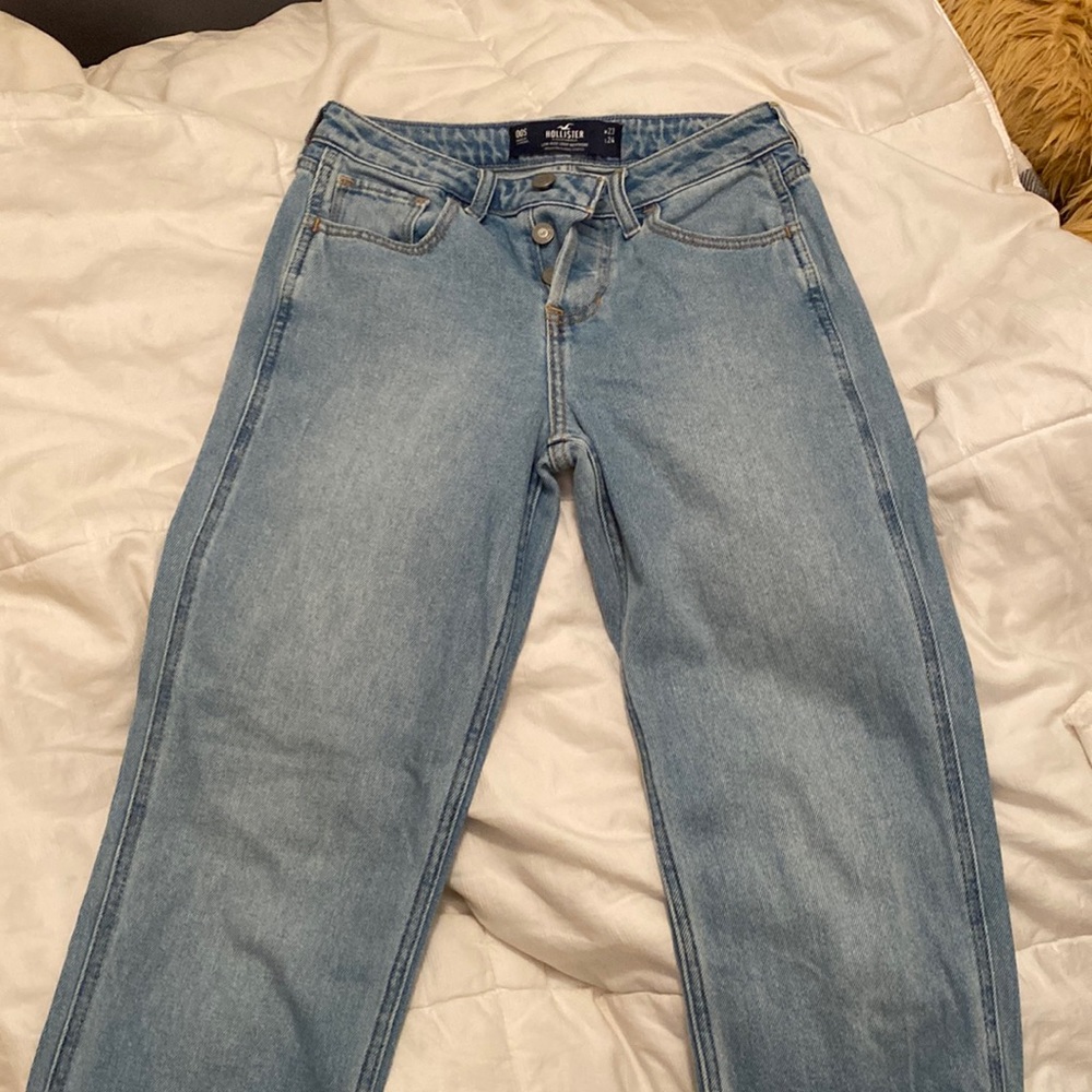 Low rise boyfriend jeans - hollister. Light wash w/ a heart on the back-size 00S